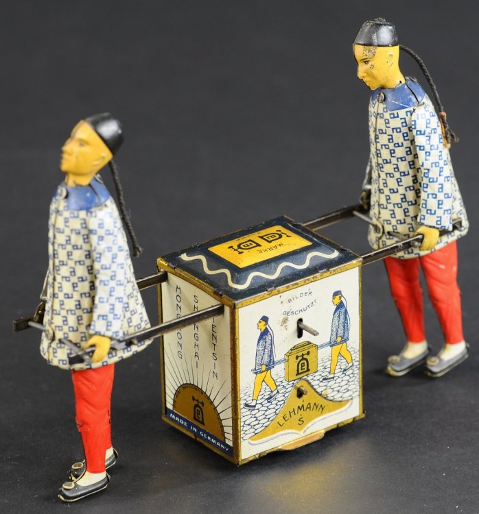 LEHMANN KADI: Germany, lithographed and hand painted tin, friction mechanism, depicts two Chinese figures hauling colorful tea chest. 7" l.