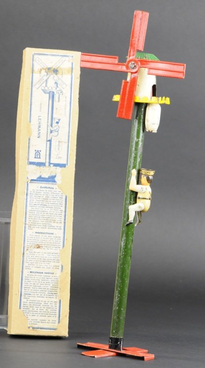 LEHMANN GUSTAF THE MILLER: Germany, lithographed tin, figure able to climb shaft of tall windmill, large weight on head allows gravity travel and spinning blades. 17" h.