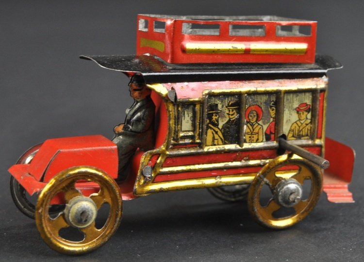 DOUBLE DECKER BUS PENNY TOY: Meier, Germany, a rare all original example of tin lithographed bus, nicely detailed, passenger graphics appear at side windows, seated driver. 3" l.