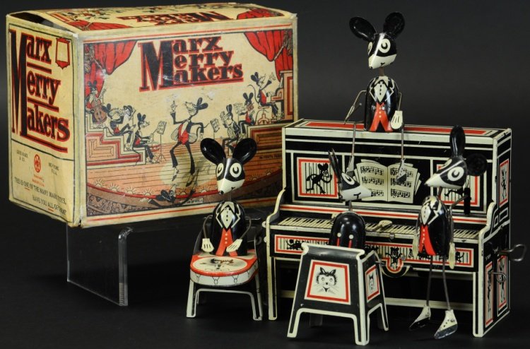MARX MERRY MAKERS BAND WITH BOX: Conductor version, popular lithographed tin toy, depicts familiar four mice band at piano, key wind operated. 9" x 8 1/4".