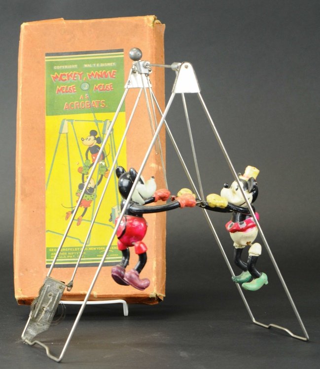 MICKEY AND MINNIE MOUSE ACROBATS: Japan, copr. Walt Disney, Geo Borgfeldt Co., boxed example, features celluloid figures of Mickey and Minnie on wire frame bar with clockwork mechanism. 11 1/2" h.