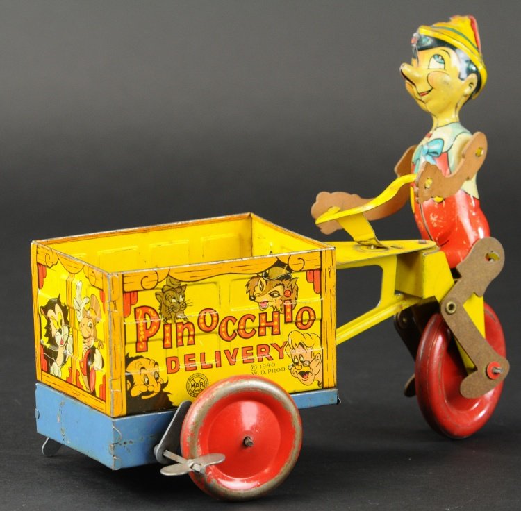 MARX PINOCCHIO DELIVERY CART: Copr. Walt Disney Prod., lithographed tin, wind up toy, Pinocchio's legs made of cardboard and able to pedal cart, side reads 'Pinocchio Delivery.' 9 1/2" l.