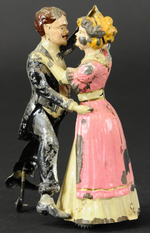 TANGO DANCERS: Gunthermann, Germany, hand painted tin, depicts couple dancing the classic tango, clockwork driven. 8" h.