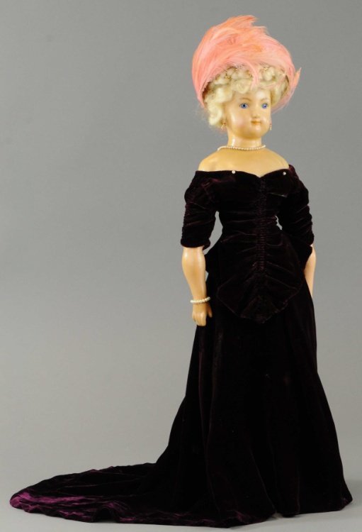 GERMAN WAX FASHION LADY DOLL: Unusual doll with wax shoulder head mounted to cloth body with wax lower arms and composition lower legs, molded and painted boots with higher heels, she has inset blue glass eyes, platinum mohair wig
