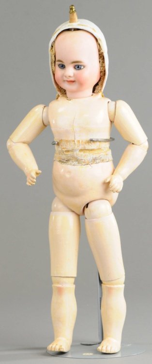 RARE TWO FACED DOLL: Head attributed to Simon & Halbig and both the 'laughing' and 'crying' expression sides have inset blue glass eyes, paper mache cap obscures one side at a time, and head is jointed by a turning mechan