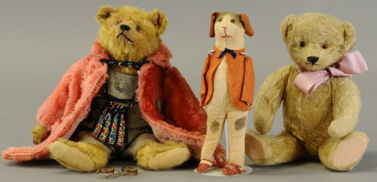 LOT OF THREE STUFFED TOYS: Included are a nice Teddy (not Steiff) wearing Lederhosen and a similarly 'fur' coat; a 1930's teddy, and a one piece cloth dog with felt jacket and shoes stated, Germany". 12" (31cm) - 8" (20cm)