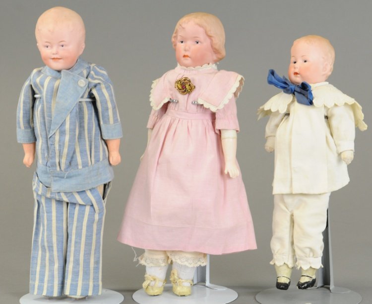 LOT OF THREE GEBRUDER HEUBACH CHARACTER DOLLS: All three dolls are shoulder heads with molded and painted features, all incised 'Heubach Germany,' and are on leather or twill covered bodies with bisque or composition arms. 11" to 12 1/2" (28 - 32 