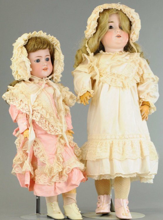 TWO GERMAN BISQUE CHILD DOLLS: Largest is a Kestner 164 with fixed brown glass eyes on original body with typical age wear, along with Simon & Halbig 550 with blue glass sleep eyes on original body with two fingers missing, light w