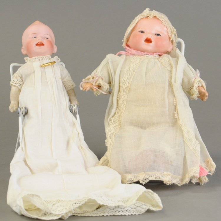 TWO GERMAN BISQUE HEAD CHARACTER BABIES: Included are Gebruder Heubach shoulder head incised '8806,' on a muslin covered cloth body with composition lower arms and an unusual flange neck baby by Armand Marseilles on cloth body with compositi