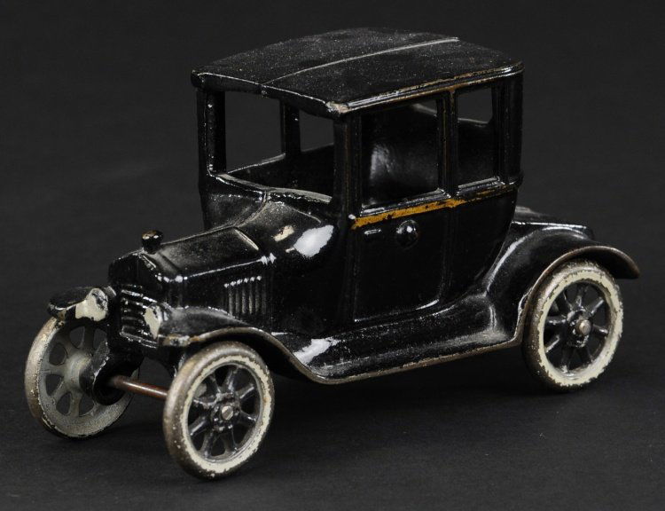 ARCADE FORD MODEL 'T' COUPE: Arcade, cast iron, painted in black overall, spoke wheels, painted in grey around wheels. 6 1/2" l.
