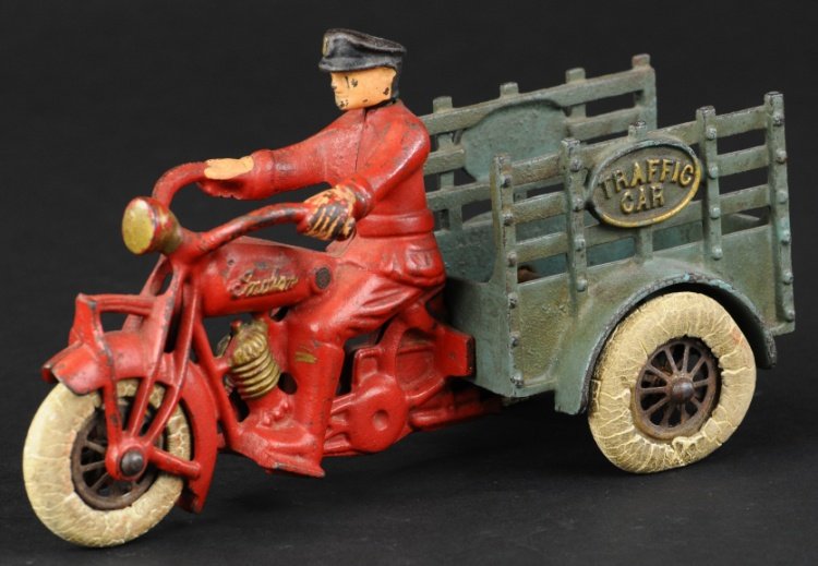 HUBLEY TRAFFIC CAR MOTORCYCLE: Cast iron Indian model done in red with attached blue stake side body embossed 'Traffic Car,' cast driver, white rubber tires on nickel hubs, toy would benefit from good cleaning. 8 1/2" l.