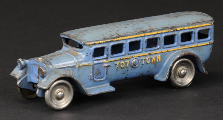 KILGORE 'TOY TOWN' BUS: Scarce example, c. 1930, cast iron, painted in blue body, orange striping, cast lights, nickel disc wheels, embossed lettering on sides. 7 3/4" l.