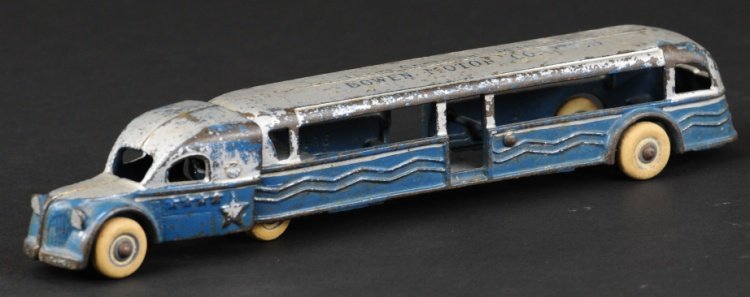 TEXAS CENTENNIAL 'BOWEN MOTOR COACH': Arcade, very rare example, cast iron, painted in blue and silver, stenciled roof, tandem piece has well styled cab, rubber tires. 10 1/2" l.