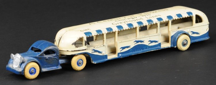CENTURY OF PROGRESS BUS: Arcade, cast iron, tandem example done in blue and white overall, stenciled 'Century of Progress - Chicago 1933' on roof, white rubber tires, largest in series. 14" l.