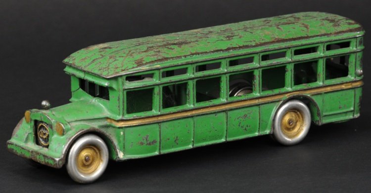 ARCADE 'ACF' BUS: Cast iron, scarce interurban style bus example painted green overall, gold side stripe, radiator embossed 'ACF' at center, dual rear nickel plated solid wheels, opening front door. 11 1/2" l.