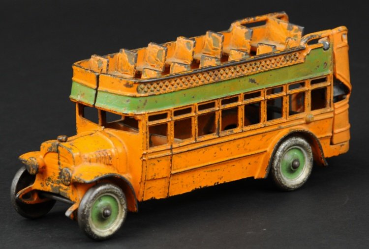 DOUBLE DECKER CITY BUS: Kenton, cast iron, painted in orange overall with wide green side stripe, features open roof bench seating, nickel disc wheels. 9 3/4" l.