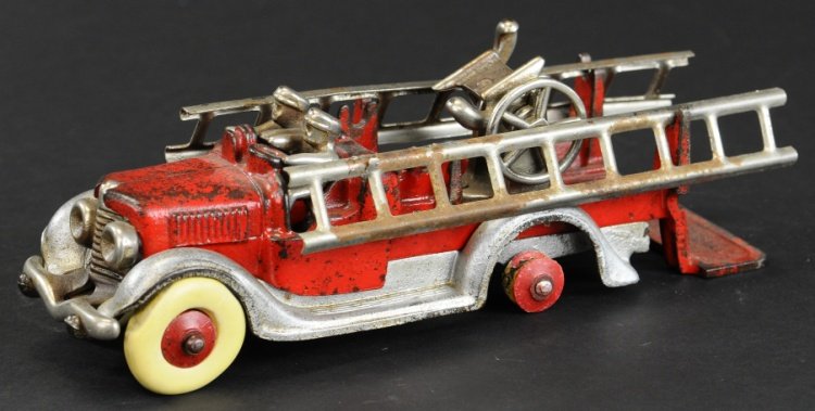 HUBLEY LADDER TRUCK: 1930's, cast iron toy painted in red body, silver frame, nickel ladders, drivers and ladder supports. Ex. Gottschalk to Kaufman Collection. 10 1/2" l.