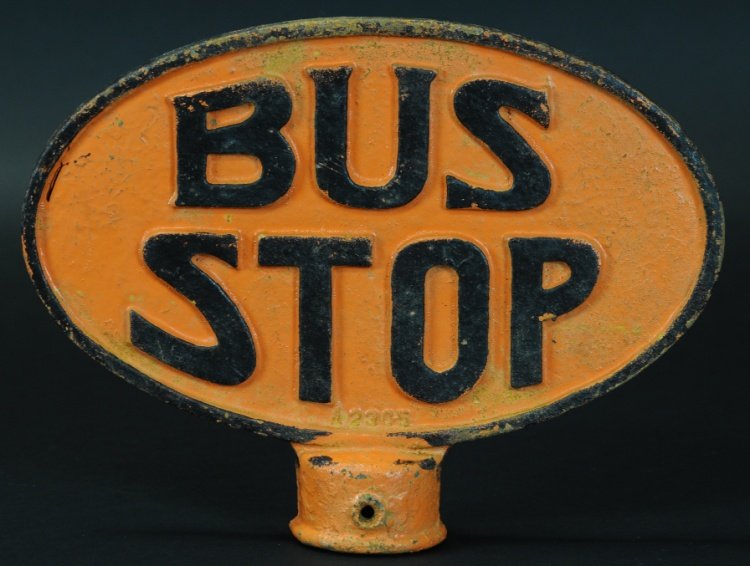 EARLY CAST IRON BUS STOP SIGN: Heavy casting of sign for Bus Stop location, oval sign painted in orange, embossed lettering done in black, able to mount on 2" pole. 10" h x 13".