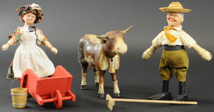 SCHOENHUT MILK MAID, FARMER AND COW: Hand painted wood examples, milk maid wears long dress with apron and holds milk pail, cow has bell and original horns, farmer in field attire with hat, includes repro wheelbarrow. Figures 8 1/2" h, C