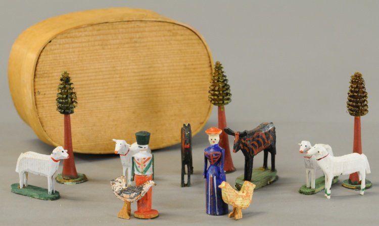 MINIATURE ERZGEBIRGE FARMER'S BOXED SET: Hand painted and carved wood set, includes three trees with shaved cured leaves, four sheep, two hens, horse, cow, man and woman, all in bentwood box. Figures 2 1/4" h.