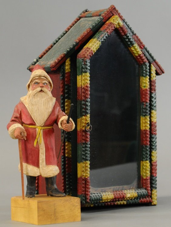 TRAMP ART HOUSE WITH SANTA: Contemporary carved Santa figure depicted inside well detailed wood e-tramp art house with opening large front door, glass view panel, Santa carved by Arthur Shoemaker.