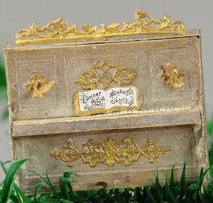 DRESDEN PIANO CANDY CONTAINER: An exquisite example of Dresden art form, this silver with gold trim piano opens at the top for candy retrieval. 2 1/2". Ex. Tom Fox Collection