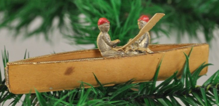 TWO MEN IN A CANOE DRESDEN: Germany, two red cap men in a canoe like boat, perhaps sculling, silver interior and trim on a tan exterior, hard to find. 3 1/2".