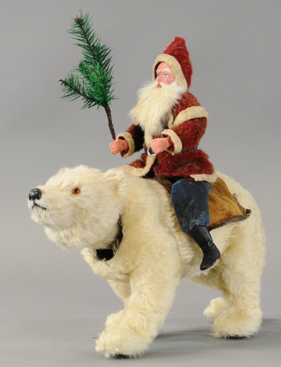 NODDING POLAR BEAR WIITH SANTA: Germany, an exceptionally large, furry polar bear nodder with glass eyes on top, composition and wire Santa mounted on top, wearing red wool coat with white trim, blue trousers over black boots, nice