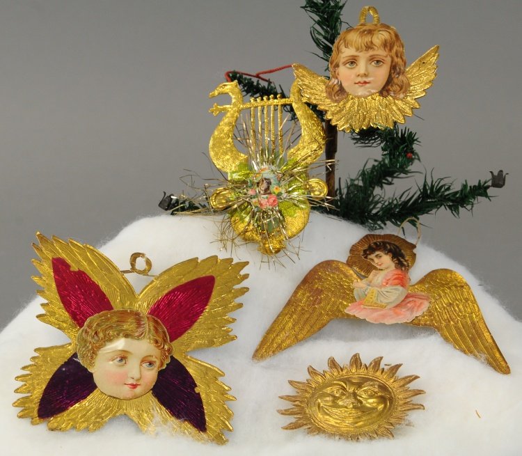 FIVE GOLDEN EMBOSSED DRESDENS: Beautiful single sided deeply embossed smiling sun face, two angels each with wings, another with girl with aura and wings behind her torso for adding a skirt, and elaborate lyre with applied tinsel a