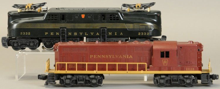 LIONEL 2332 PENNSYLVANIA GG-1 DIESEL: Postwar dark green Pennsylvania GG-1 diesel and Lionel #2028 Pennsylvania GP-7 diesel loco with gold lettering. 13" l.