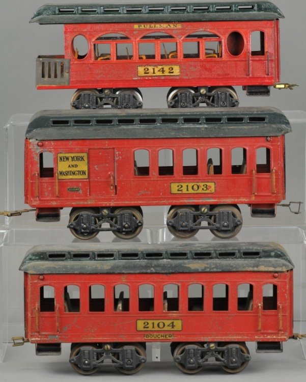THREE VOLTAMP PASSENGER CAR SET: c. 1919-1923, includes #2104 pullman, #2103 combine and #2142 observation car, all in red bodies with green roofs and interior seating. 14" l.