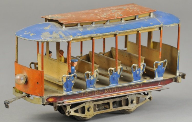 LIONEL ELECTRIC RAPID TRANSIT No. 101: Hand painted tin trolley, open sides with summer trolley interior bench seating, sides read "Electric Rapid Transit," done in blue and cream, includes three figures. 10 1/2" l.