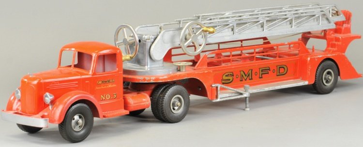 SMITH MILLER AERIAL LADDER TRUCK: L' Mack truck from the 1950's, die cast cab painted in red, pressed steel open service frame contains large extension ladder and rear driver's seat, lever controlled movement, stabilizers on sides, de