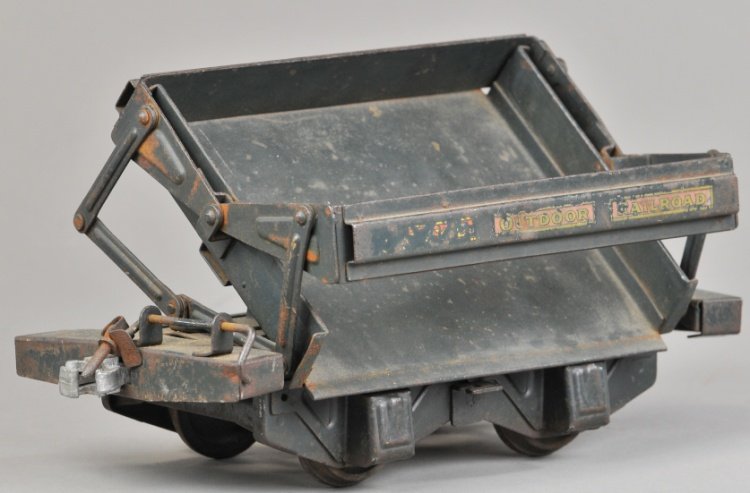 BUDDY 'L' OUTDOOR SHALLOW DUMP CAR: Rare example, pressed steel and painted in green overall, last of the Outdoor Railroad Series. 10 1/2" l.