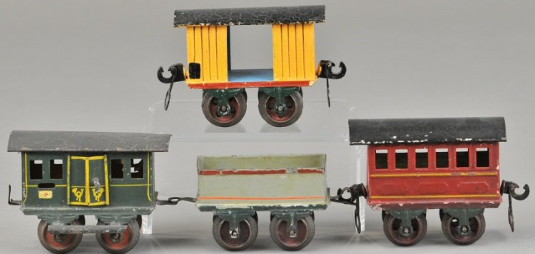 LOT OF FOUR MARKLIN TRAIN CARS: All hand painted, O gauge examples include gondola, box car, passenger coach and postal car, all original. 3 1/2" l.