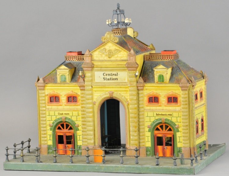 MARKLIN CENTRAL TRAIN STATION: Germany, scarce example, well detailed overall, hand enameled station complete with interior, tables, chairs and benches, quite visual having nicely embossed walls and opening doors, comes with etched
