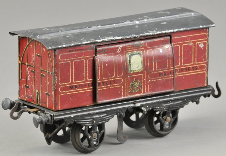 BING I GAUGE "MAIL EXPRESS": Four wheel car done in lithographed tin, maroon body, hand painted grey roof, gold lettering, features levers under the base of the van allowing operation for opening sides to collect and deposit mail
