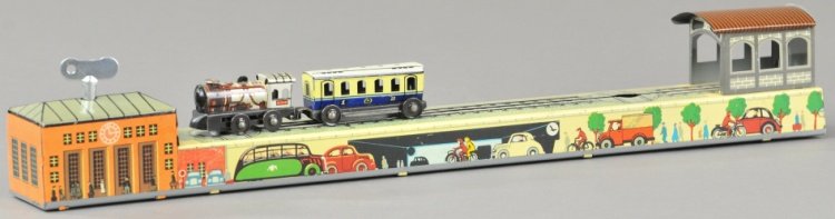TRAIN TOY: Germany, Arnold, wind up toy includes train steam engine and passenger car, loco able to turn around on track and pull passenger car. 15 1/4" l.