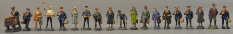 ELASTOLIN COMPOSITION RAILROAD FIGURES: Pre-war, includes porters, passengers, vendor and ticket taker, nineteen pieces. 45mm scale.
