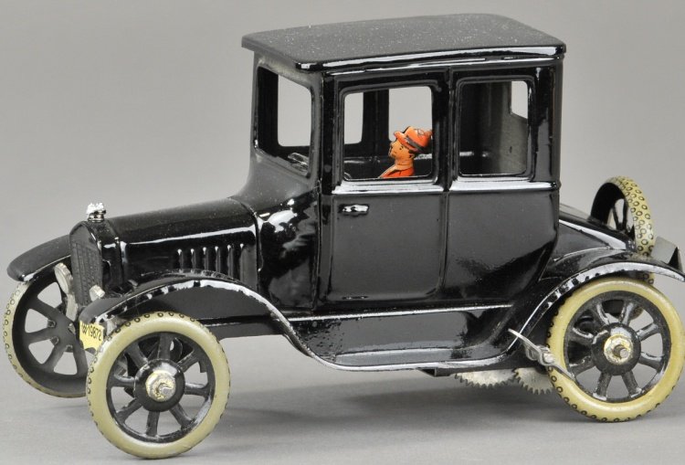 BING FORD COUPE: Germany, black tin coupe with seated man driver, radiator cap, spoke wheels, clockwork driven. 6 1/2" l.
