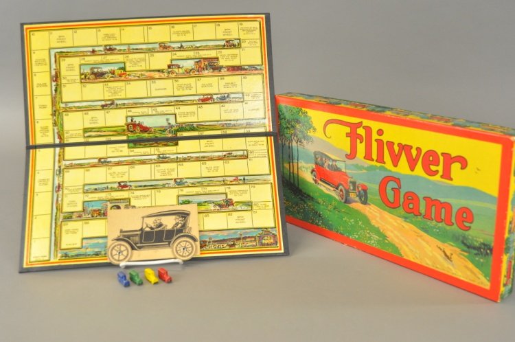 FLIVVER GAME: Milton Bradley, colorful game board and box lid, includes four die cast bus pieces and flivver spinner. 8 1/2" x 17".