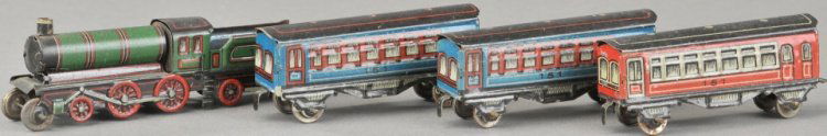 C.K.O. TRAIN PENNY TOY SET: Germany, set contains green loco/tender combination unit, together with two blue coaches and one red, each piece marked "C.K.O." 12" l.