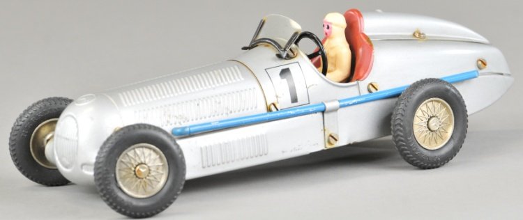 MARKLIN MERCEDES BENZ RACER: Germany, contemporary re-issue model, pressed steel body, painted in silver, blue pipes on sides, clockwork driven, seated composition figure. 10 1/2" l.