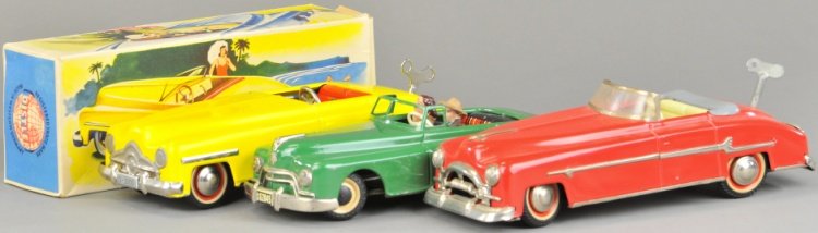 LOT OF THREE GERMAN CONVERTIBLES: Distler and Arnold examples, includes boxed yellow model, green model with two seated figures and red tin plate convertible with full windshield. 9 1/2" to 10" l.