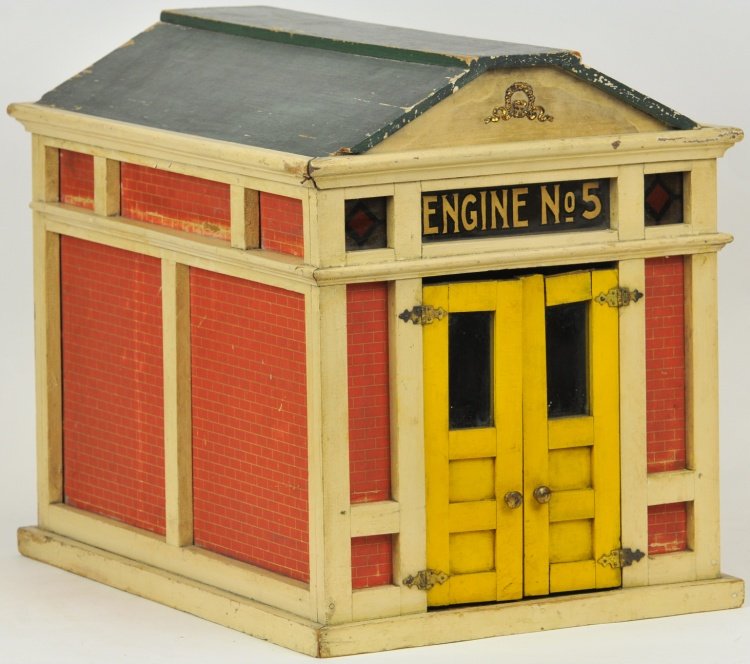ENGINE No. 5 STATION: Made of wood and hand painted, features opening front doors, glass window reads 'Engine No. 5,' litho sides simulate brick building, interior is well papered, roof done in green. 16 1/4" h x 20" l x 1