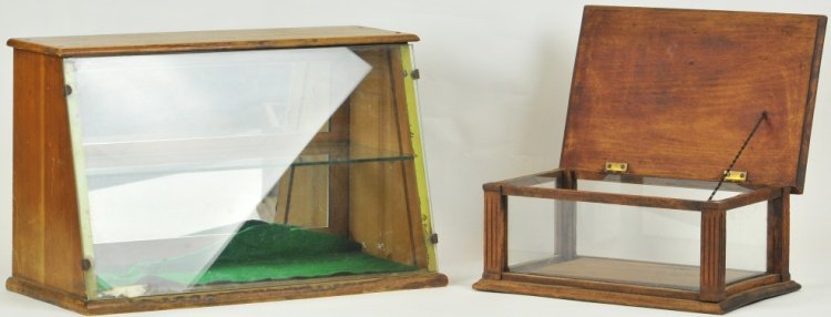 TWO COUNTRY STORE DISPLAY CASES: Includes slant front oak and glass case, mirrored back and small Eastlake column display case, oak and glass. 14" to 21".