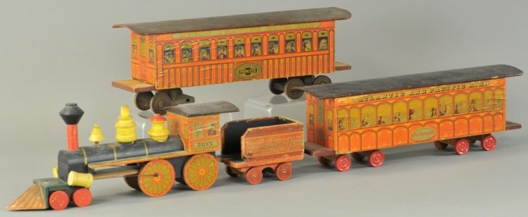 REED'S GOLDEN GATE SPECIAL TRAIN SET: c. 1889, paper over wood Duke Locomotive with Golden Gate Tender and two coaches, one reads "Princess," and one reads "City of Springfield." Loco 16", Car 19" l.