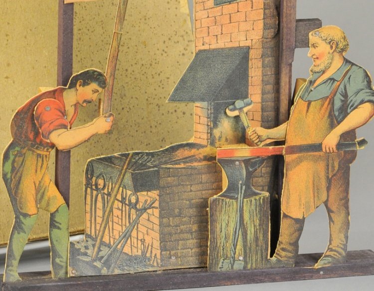 VILLAGE BLACKSMITH STEAM TOY: Weeden, c. 1890's, boxed example, paper litho die cut, early piece with great imagery of two workers at furnace, toy operated with steam engine as pulley accessory turned and allowed motions to figure