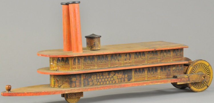 REED PIONEER STERNWHEELER PADDLEBOAT: Very rare example, lithographed paper over wood with printed spokes on wood stern paddle wheel, lettered "Pioneer" on pilot house, two stacks at upper deck, freight on board depicted at first level, i