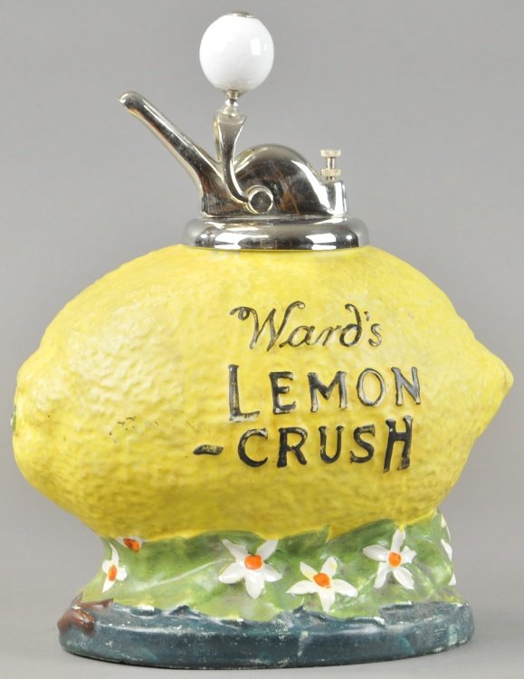 WARDS LEMON CRUSH SYRUP DISPENSER: Classic lemon shaped figural soda fountain dispenser with porcelain knob pump, embossed lettering. 14" h.